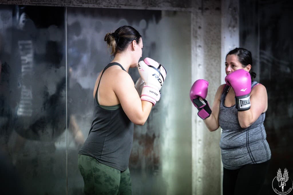 Two women training boxing