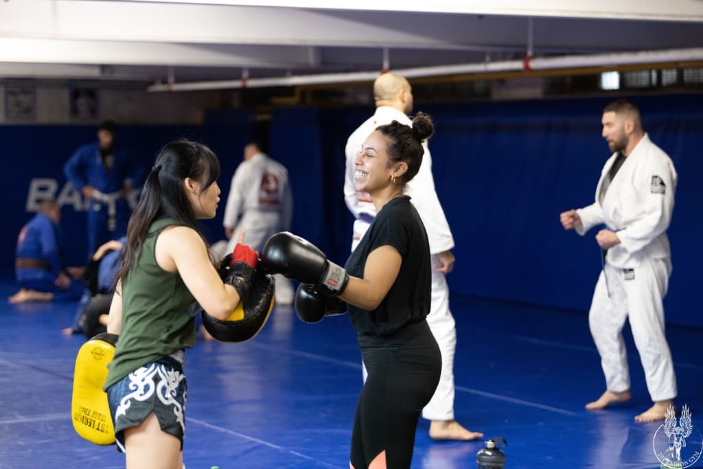 Two women training boxing